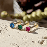 three different colored stones sitting on top of each other