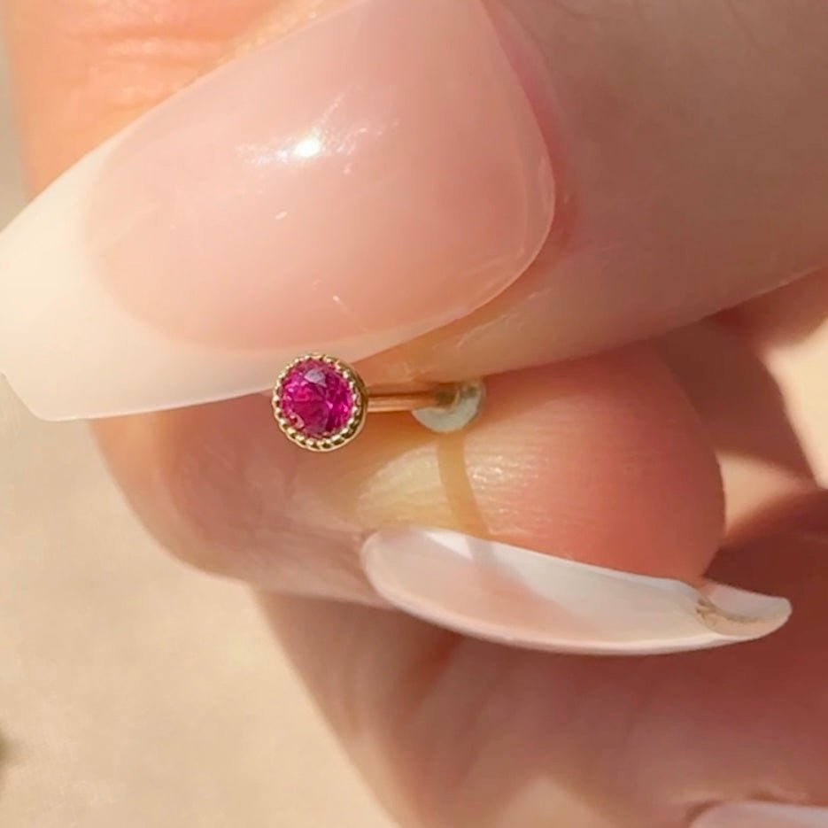 a close up of a person's hand with a ring on it