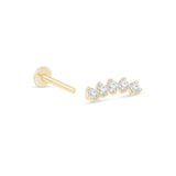a pair of gold earrings with three diamonds