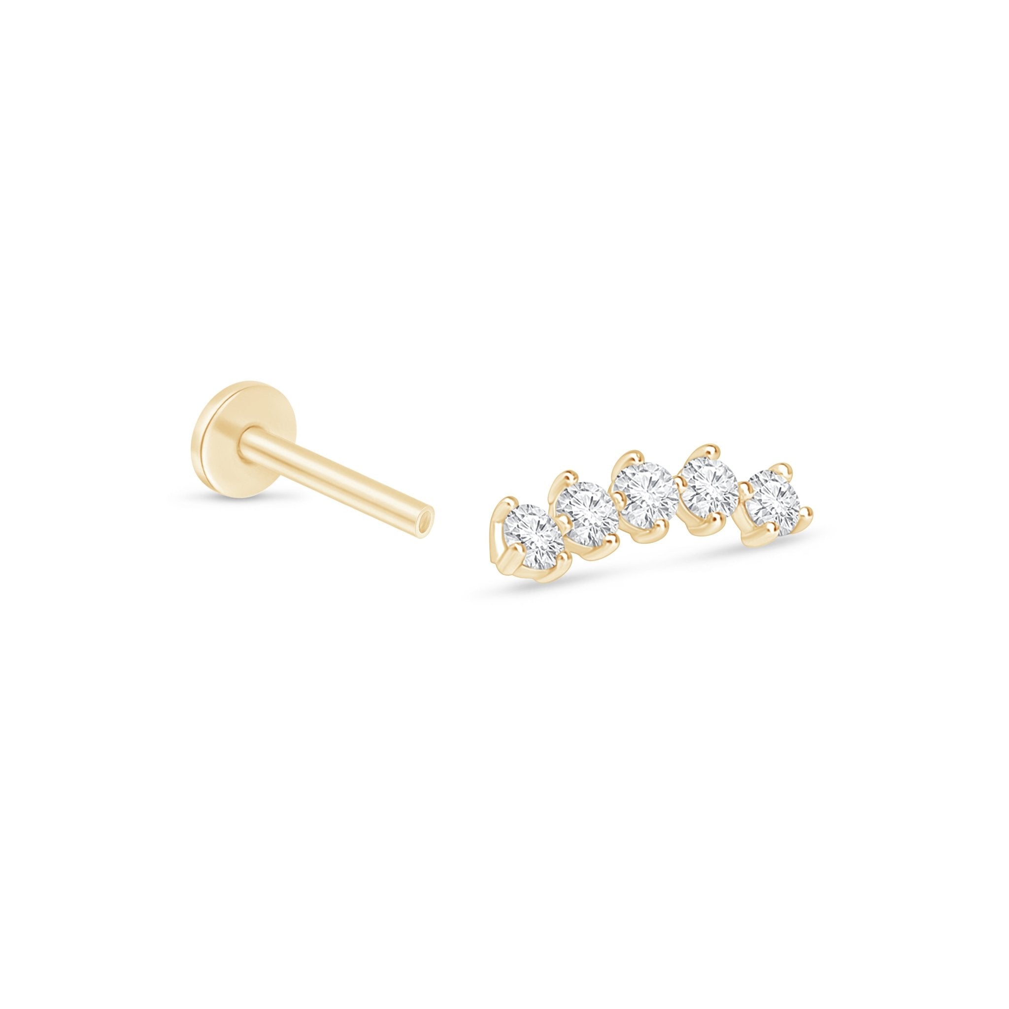 a pair of gold earrings with three diamonds