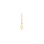 a gold heart charm on a white background