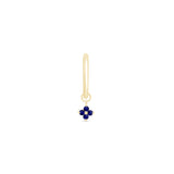 a gold earring with a blue flower