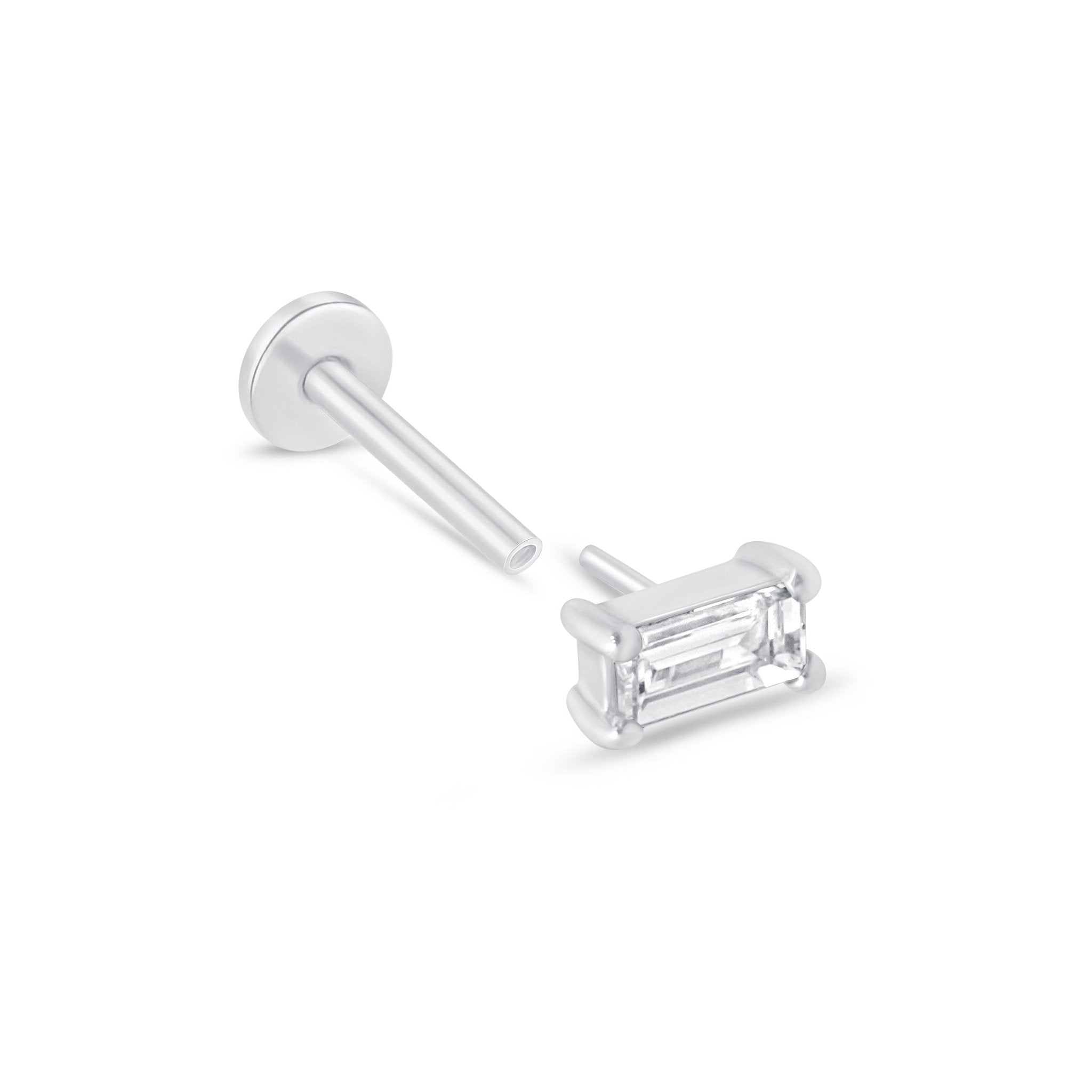 a pair of diamond earrings on a white background