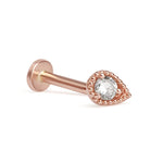 a rose gold nose piercing with a crystal stone