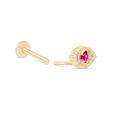 a pair of gold earrings with a pink stone