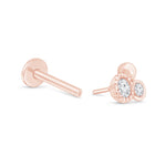 a pair of rose gold earrings with diamonds