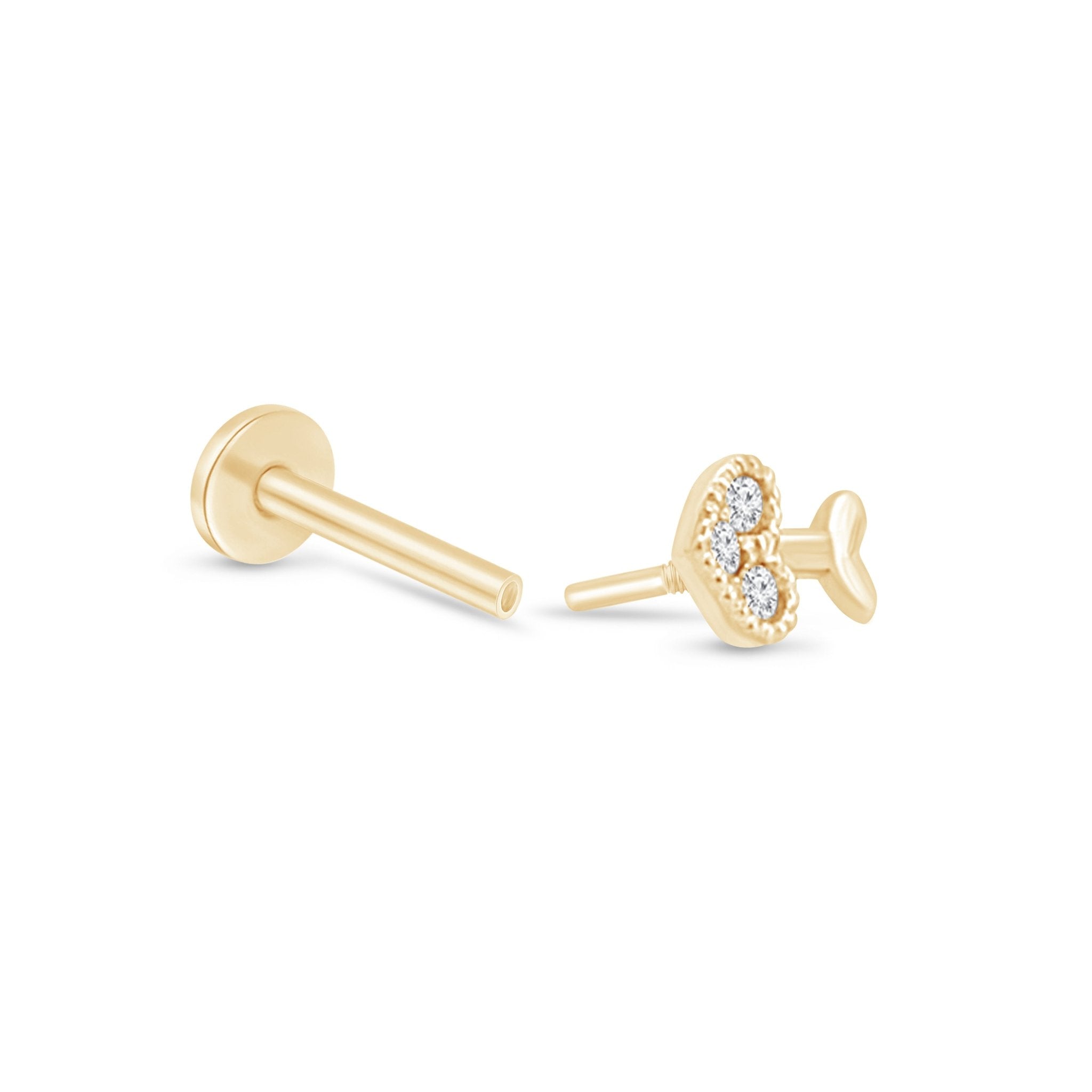 a pair of gold earrings with diamonds