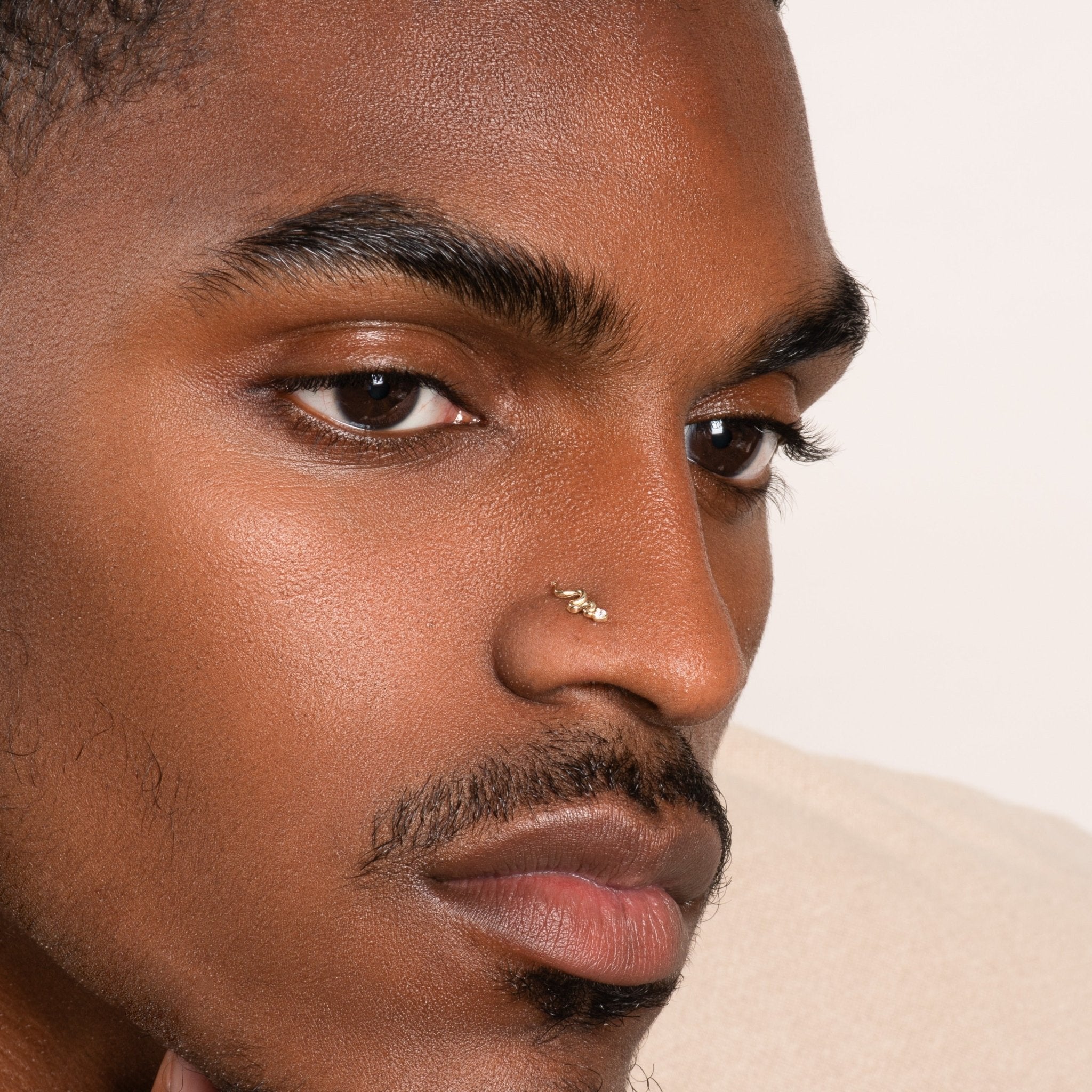 a close up of a person with a nose piercing