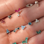 a person's hand holding a bunch of rings