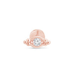 a rose gold ring with a diamond in the middle