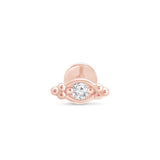 a rose gold ring with a diamond in the middle