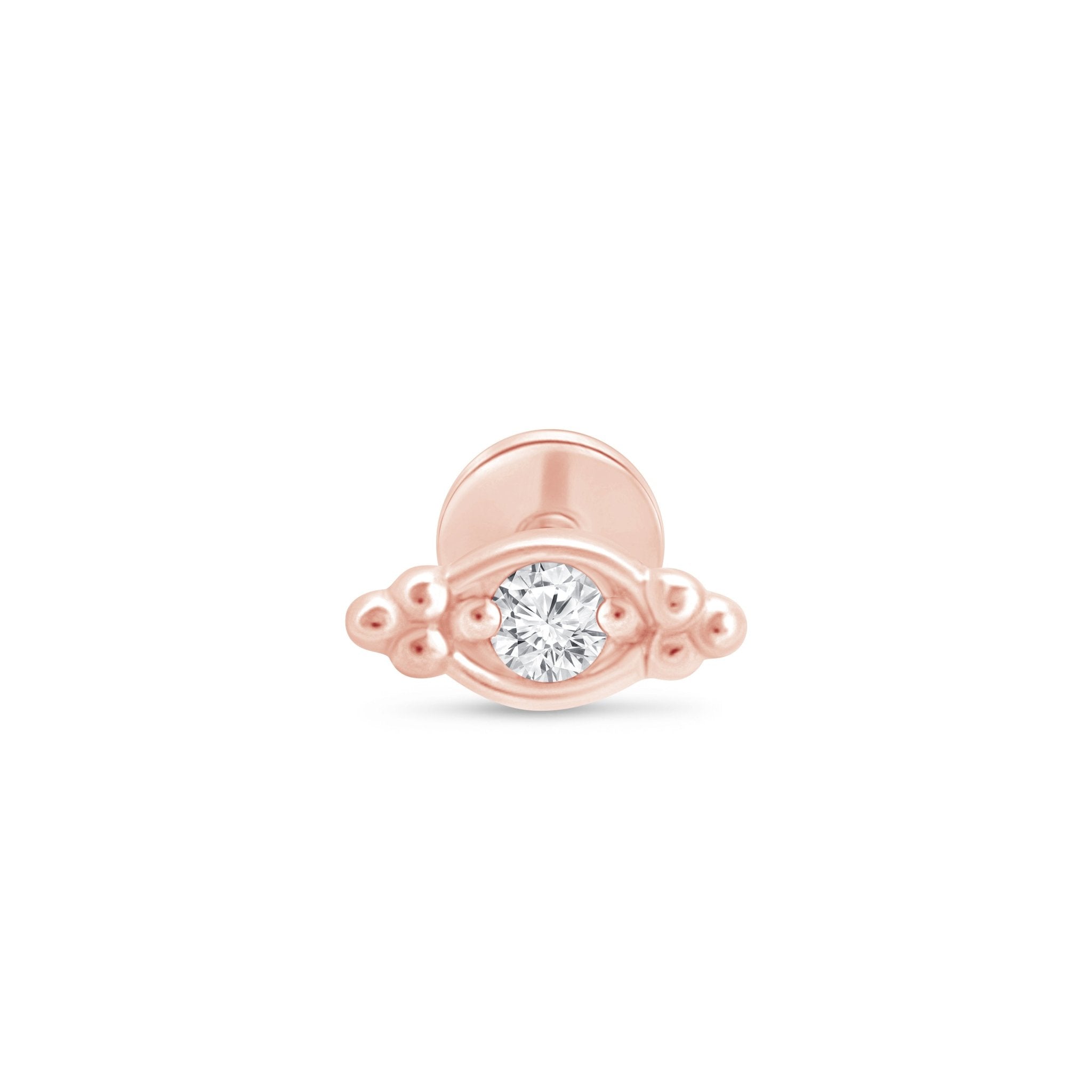 a rose gold ring with a diamond in the middle