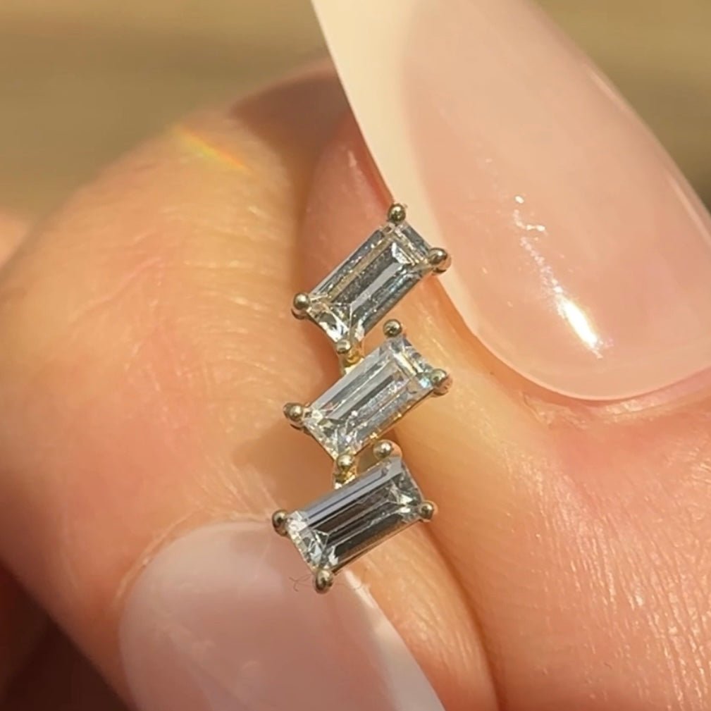 a close up of a person's hand with a ring on it