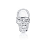 a silver skull ring with a white background