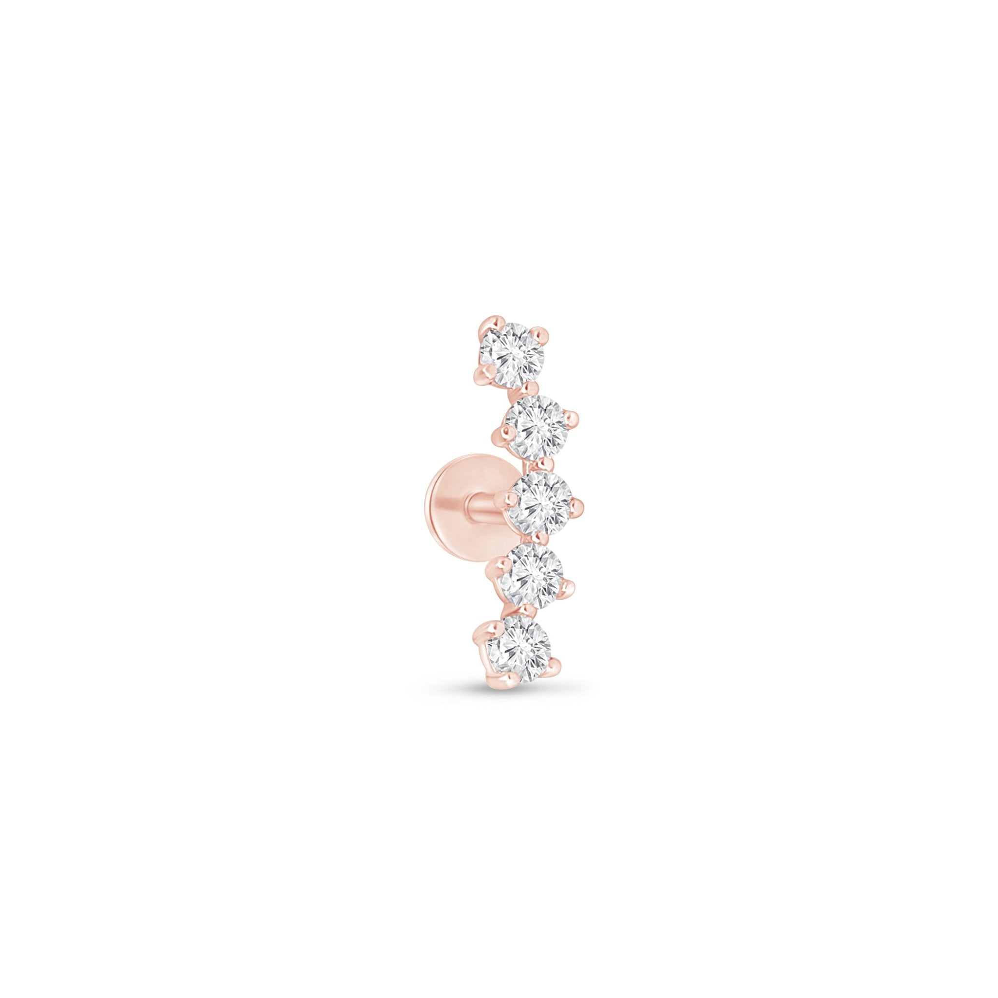 a rose gold nose ring with three diamonds