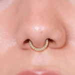 a close up of a person with a nose ring