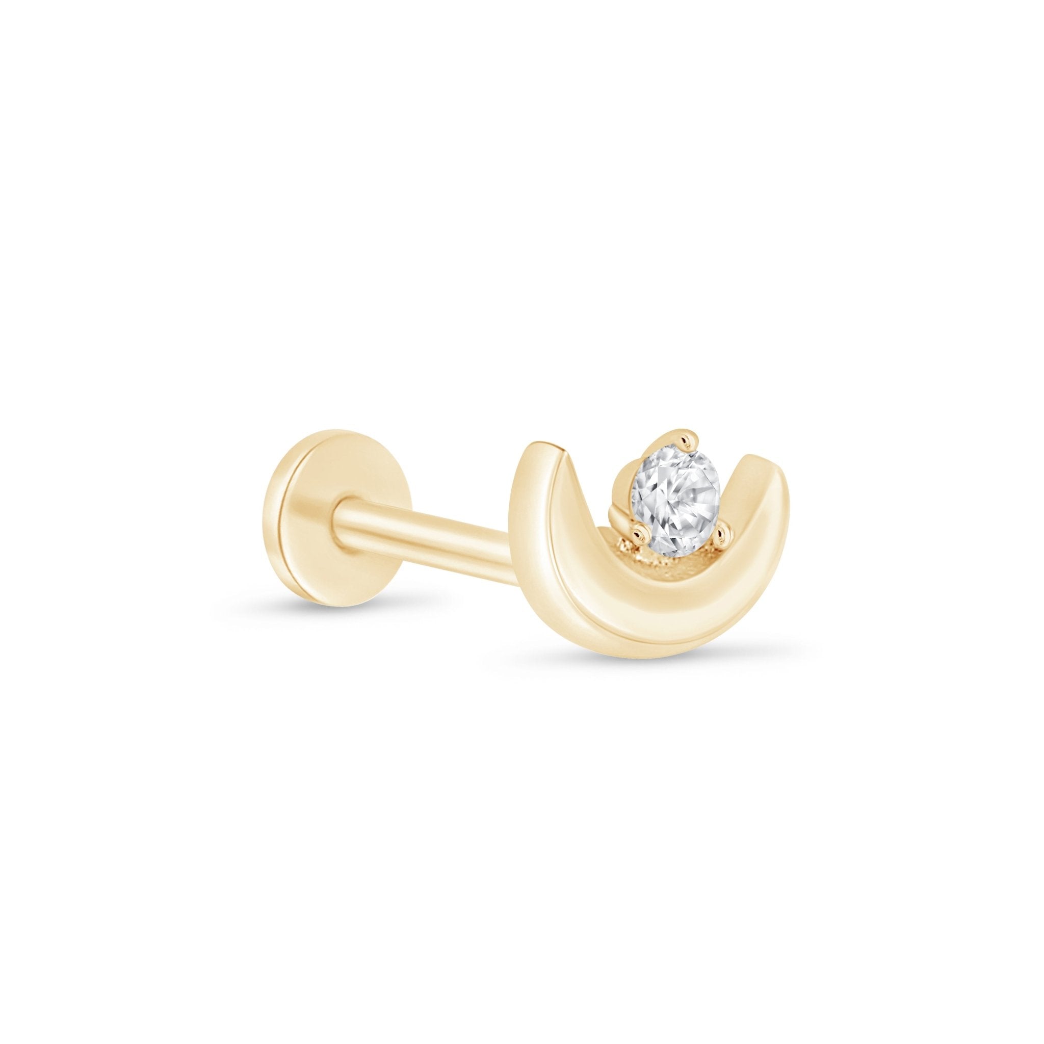 a pair of gold earrings with a single diamond