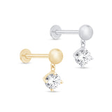 a pair of earrings with a single diamond