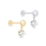 a pair of earrings with a single diamond