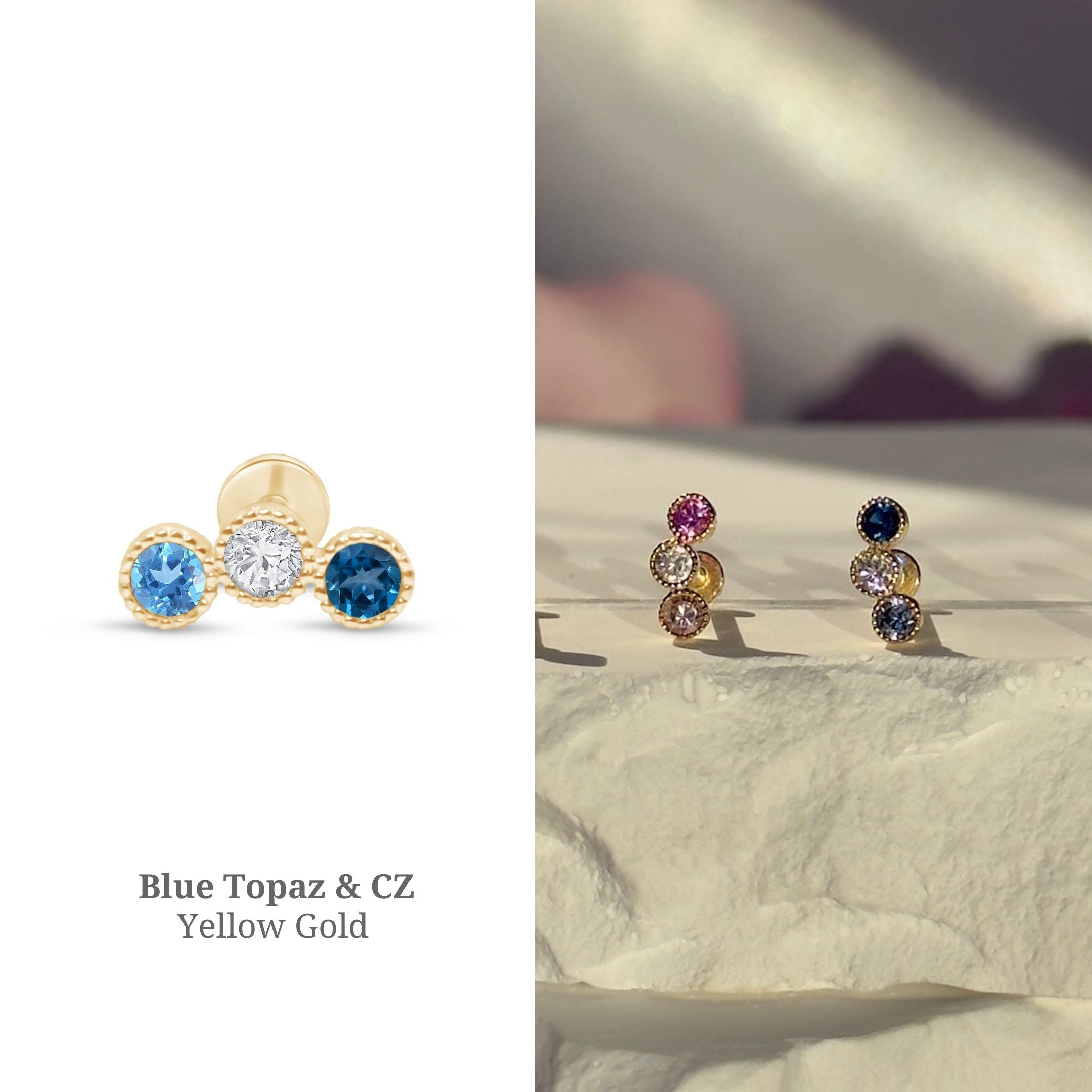 a pair of blue topaz and yellow gold earrings