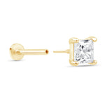 a pair of yellow gold earrings with a princess cut diamond