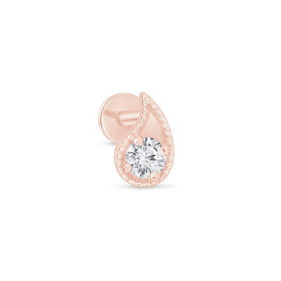 a rose gold earring with a single diamond