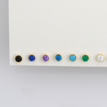 a white board with different colored stones on it