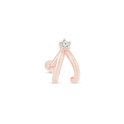 a rose gold ring with a diamond in the middle