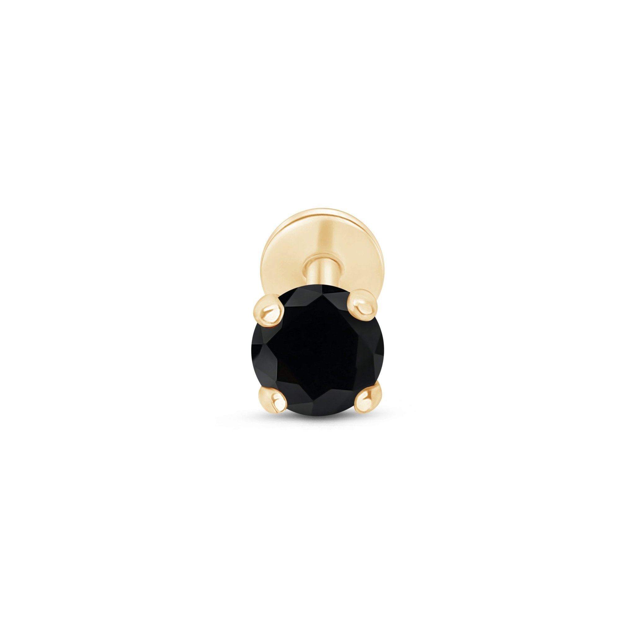 a pair of black diamond earrings in yellow gold