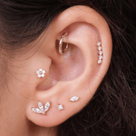 a close up of a person with a ear piercing