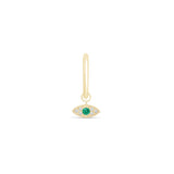 a gold earring with an evil eye charm