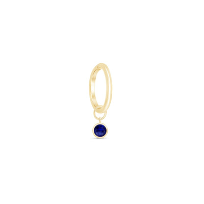 a gold ring with a blue stone