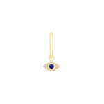 a gold earring with an evil eye charm