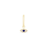 a gold earring with an evil eye charm