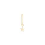 a small gold star charm on a white background