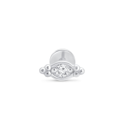 a white gold ring with a diamond in the middle