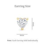 a pair of earrings with a heart shaped diamond