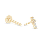 a pair of gold earrings with a cross design