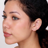 a close up of a person with ear piercings