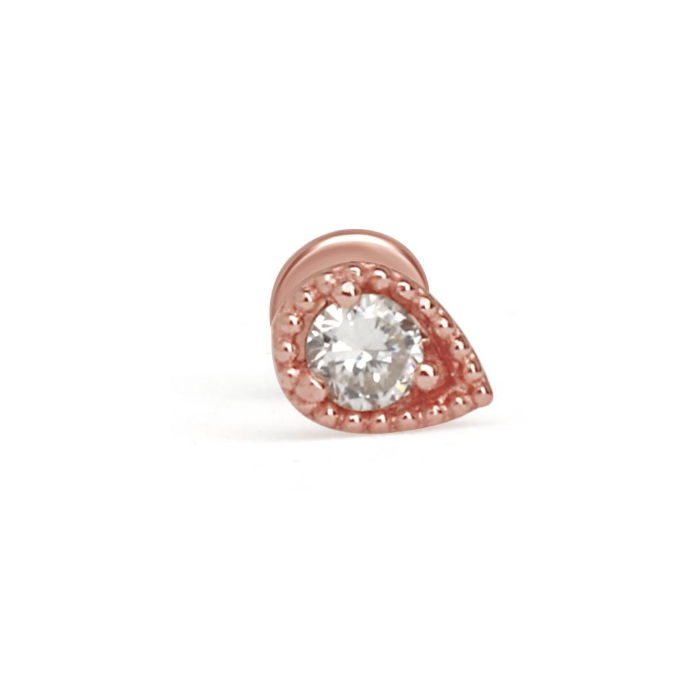 a rose gold ring with a white diamond