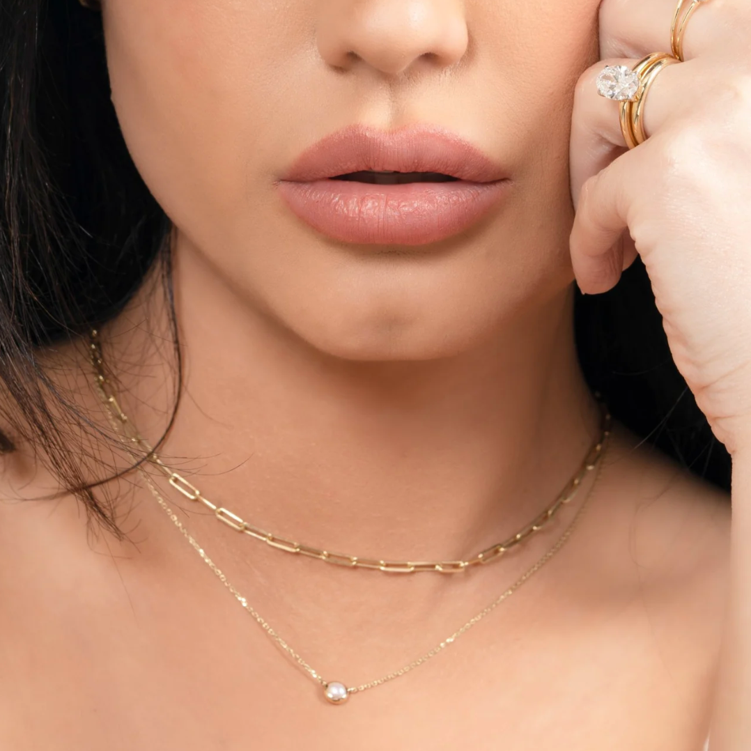 a woman wearing the freshwater pearl station necklace