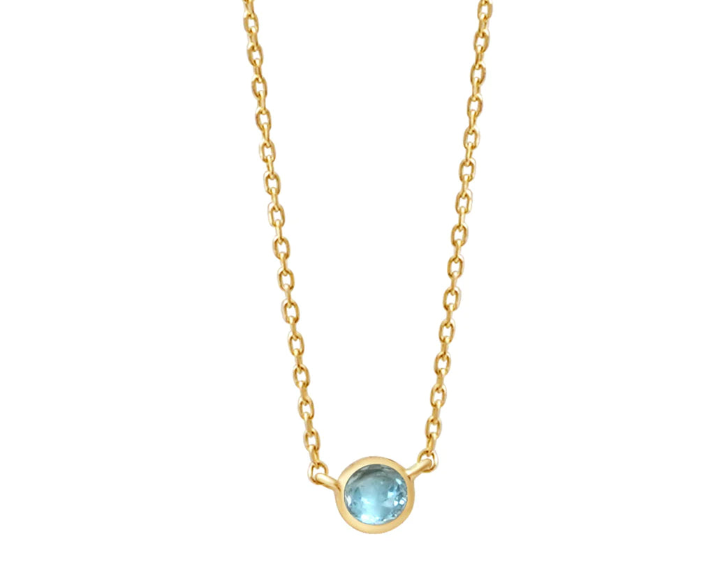 a yellow gold and aquamarine birthstone station necklace