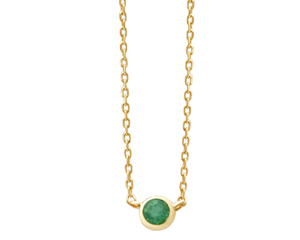 a yellow gold and emerald birthstone station necklace