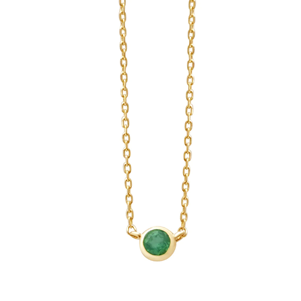 a yellow gold and emerald birthstone station necklace