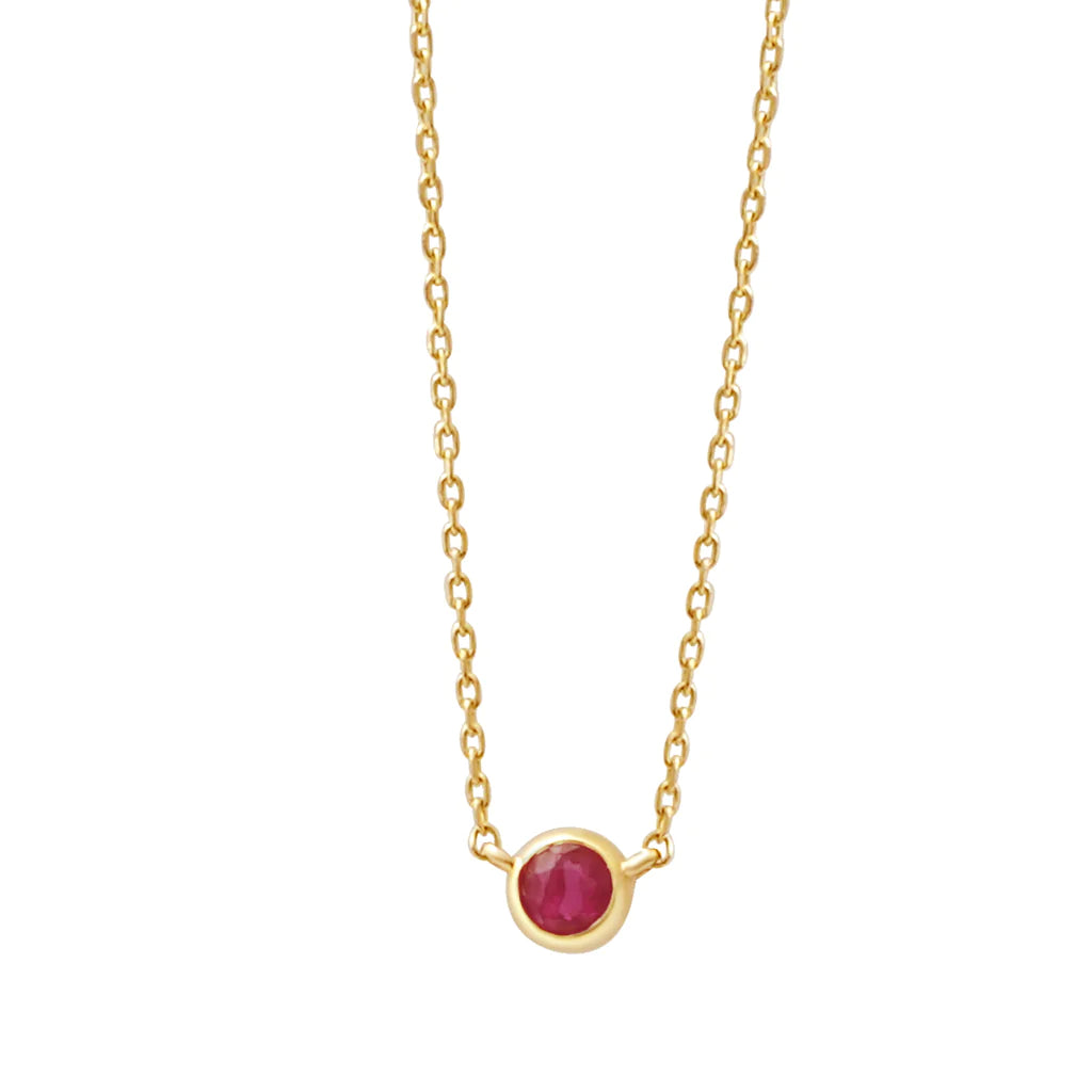 a yellow gold and ruby birthstone station necklace