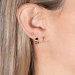 model wearing the diamond flat back stud along with other earrings