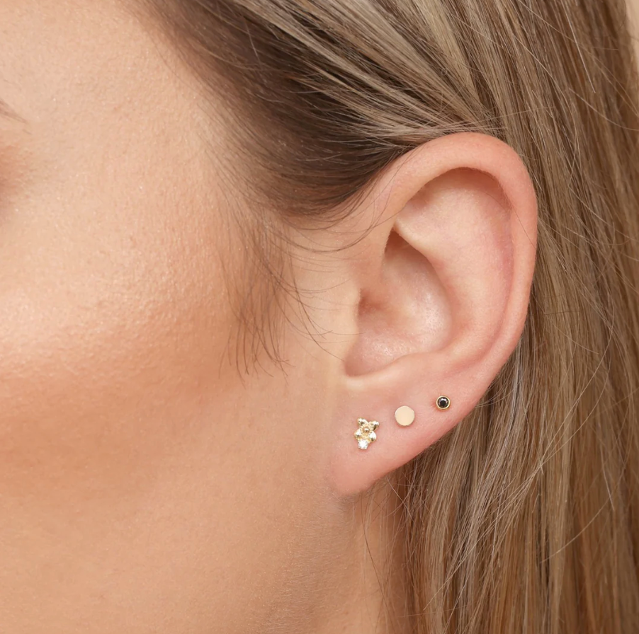 model wearing the yellow gold disc flat back stud