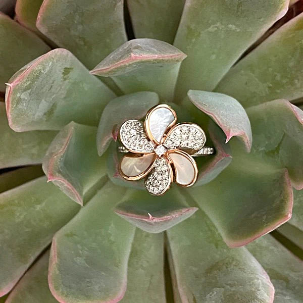 mother of pearl diamond pave flower cocktail ring in a succulent