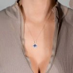 Blue Sapphire Clover Pendant with White Sapphire Halo in Solid 10k Yellow Gold